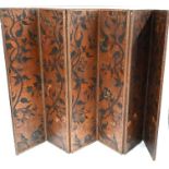 An Arts & Crafts period hand painted leather six panel folding screen, 288 cm w x 195 cm h