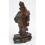 A 19th century Chinese burr wood immortal on associated stand