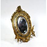 A 19th century ormolu easel toilet mirror