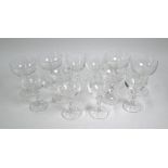 A set of six champagne saucers and matching wine glasses