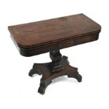 An early Victorian ebony inlaid mahogany card table