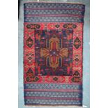 A modern Persian geometric design rug on dark ground, 142 cm x 83 cm (2)