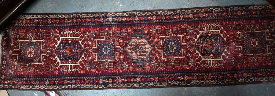 A Persian Heriz runner, 285 cm x 78 cm