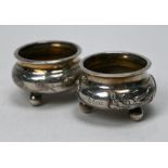 Two Chinese export silver open salts with dragon and prunus decoration