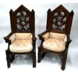 A substantial pair of antique Gothic Revival oak throne chairs