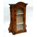 An antique kingwood cabinet