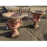 A weathered pair of cast terracotta campana urns