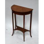 A small antique satinwood demi-lune side table