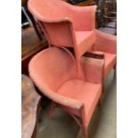 A set of three red painted Lloyd Loom elbow chairs