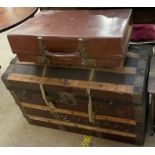 A wooden bound domed top trunk,
