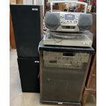 An Akai three section stacking HIFI system with cabinet and speakers together with a Sony radio