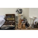 A cased antler handled carving set together with cased flatware, candelabra, resin figures,