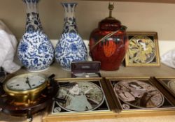 A set of four Art Nouveau inspired pottery tiles depicting the four seasons together with an Exodus