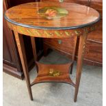 An Edwardian satinwood occasional table with an oval top painted with an image of Diana and Cupid,