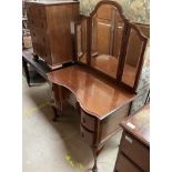 An Edwardian mahogany dressing table with tryptych mirror and five drawers on cabriole legs and pad