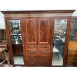 An Edwardian mahogany triple wardrobe,