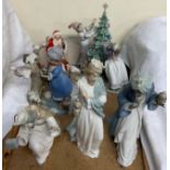 A Lladro figure group of children dressing a Christmas tree,