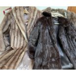 A dark brown three quarter length fur coat together with two other fur coats