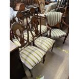 An Edwardian inlaid mahogany part salon suite comprising a lady's arm chair,