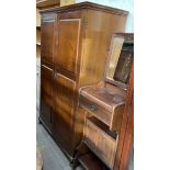 A 20th century mahogany compactum style wardrobe,