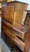 A 20th century mahogany compactum style wardrobe,