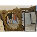 A pair of gilt framed wall mirrors together with another mirror