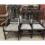 A set of six 17th century style oak dining chairs with carved backs and drop in seats on barley