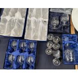 Cased sets of French cut glass drinking glasses including champagne,