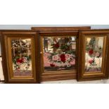 A pair of late Victorian / Edwardian oak framed wall mirrors decorated with baskets of flowers