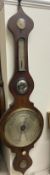 A Victorian mahogany onion topped banjo barometer, with an hydrometer, alcohol thermometer,