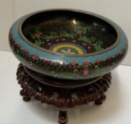 A Japanese cloisonne bowl, decorated with flowers and leaves,