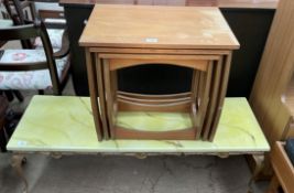 A nest of three tables together with a marble effect coffee table