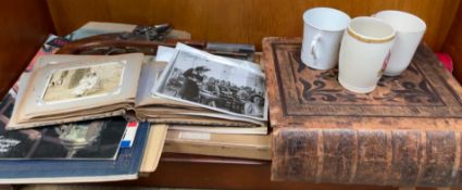 A leather bound bible together with a replica flintlock pistol, royalty memorabilia,