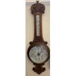 An oak cased aneroid barometer,