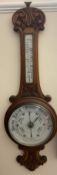 An oak cased aneroid barometer,