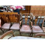 A set of four 19th century inlaid mahogany dining chairs with a pierced back,