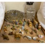 A collection of Wade pottery figures and animals together with glass vases etc