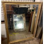 A large gilt framed wall mirror together with three other wall mirrors