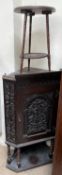 A 19th century carved oak standing corner cupboard together with a carved three legged occasional