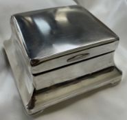 A George V silver cigarette box of square form,