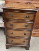 A 20th century mahogany chest of drawers on bracket feet