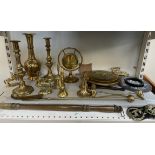 Assorted brasswares, including candlesticks, bells, warming pan,