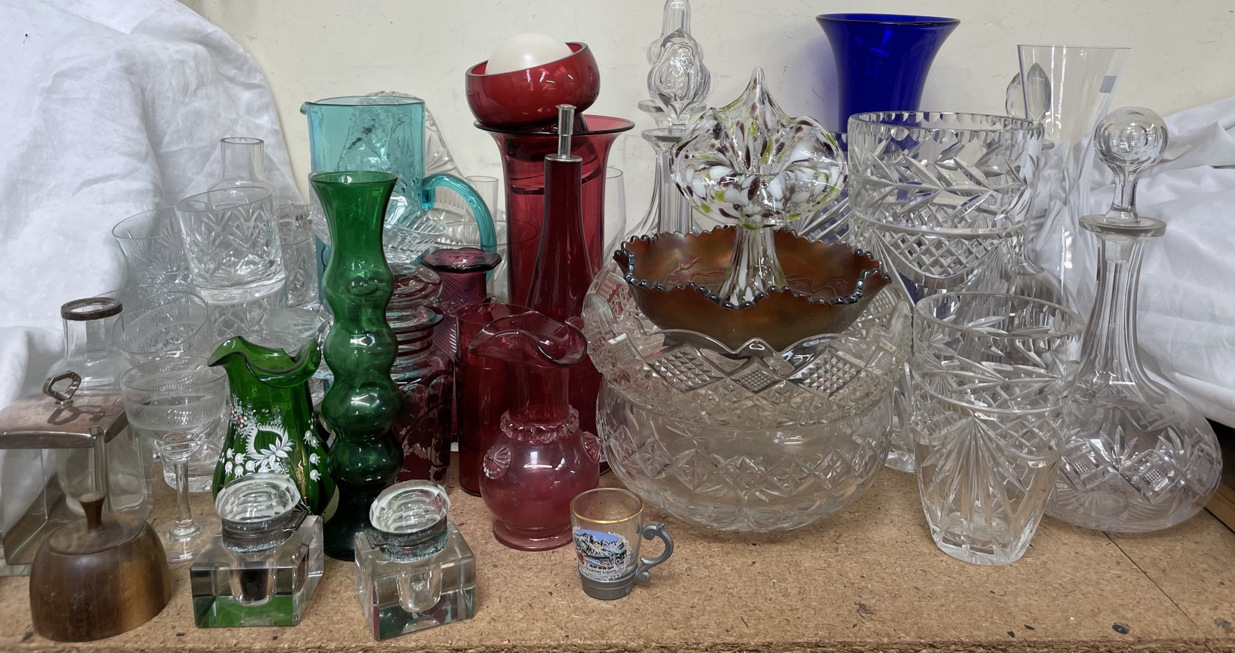 Cranberry glass vases together with glass decanters, drinking glasses,