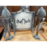 A white metal fire screen of pointed arch form,