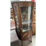 A French walnut and gilt metal mounted vitrine with a marble inset top with three quarter gallery
