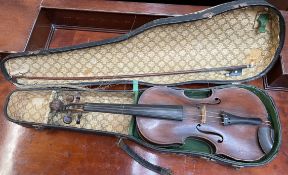 A Violin with a single back and ebonised stringing, bears a label "Antonius Straduarius Cremona....
