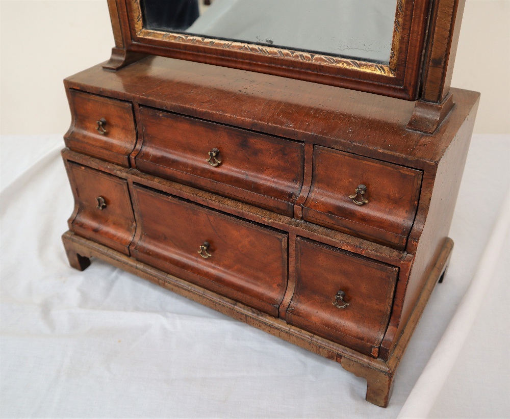 An 18th century walnut toilet mirror with a shield shaped plate and six drawers on bracket feet, - Image 2 of 4