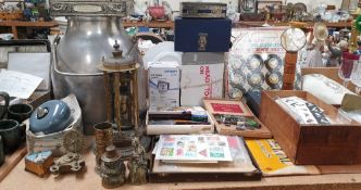 A stainless steel milk churn, together with stamps, records,