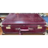 A Bugatti ox blood leather suitcase with brass corners