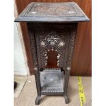 An Anglo Indian carved side table with a square top and arched sides with square legs